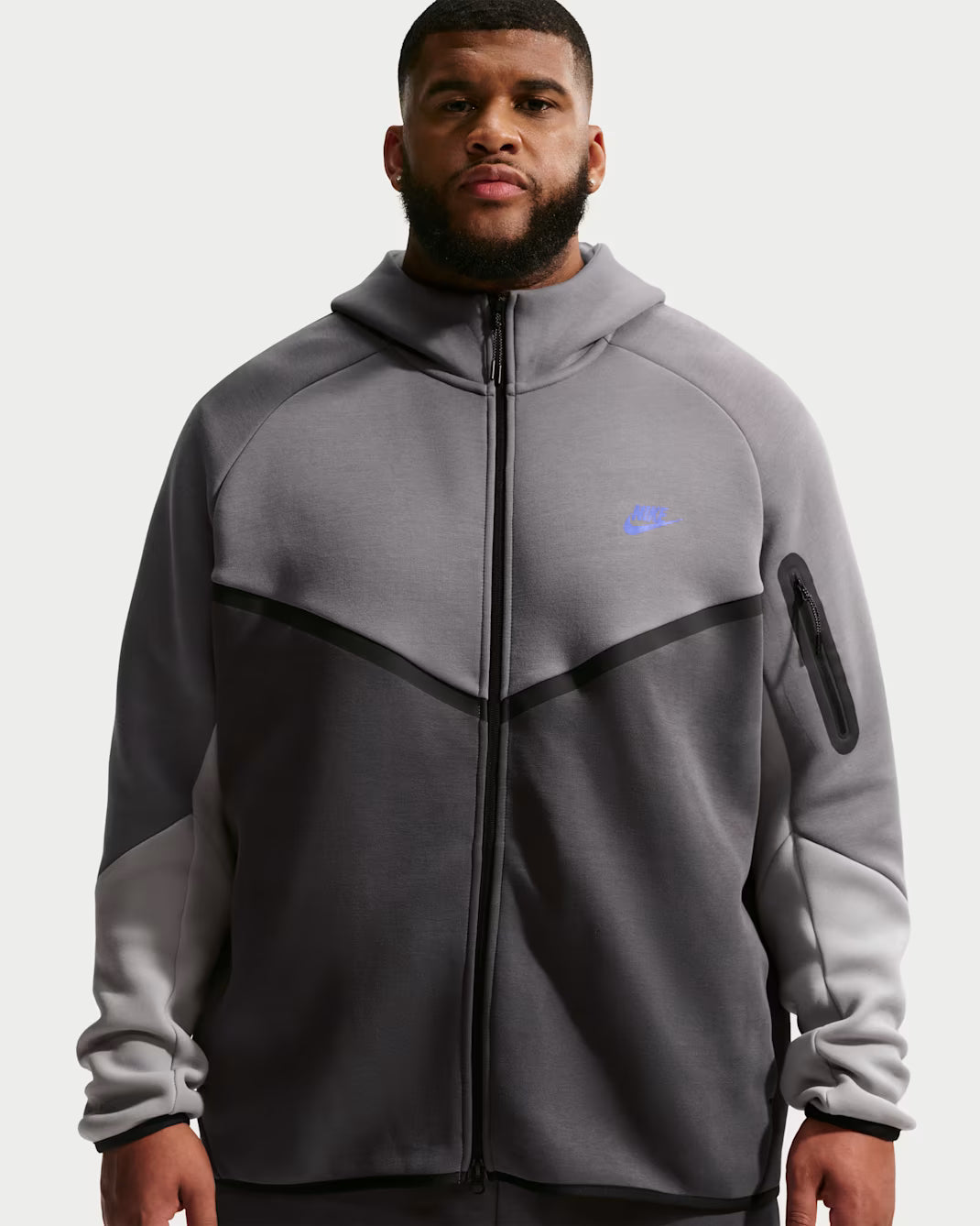 R.M Grey on dark grey Nike tech hoodie